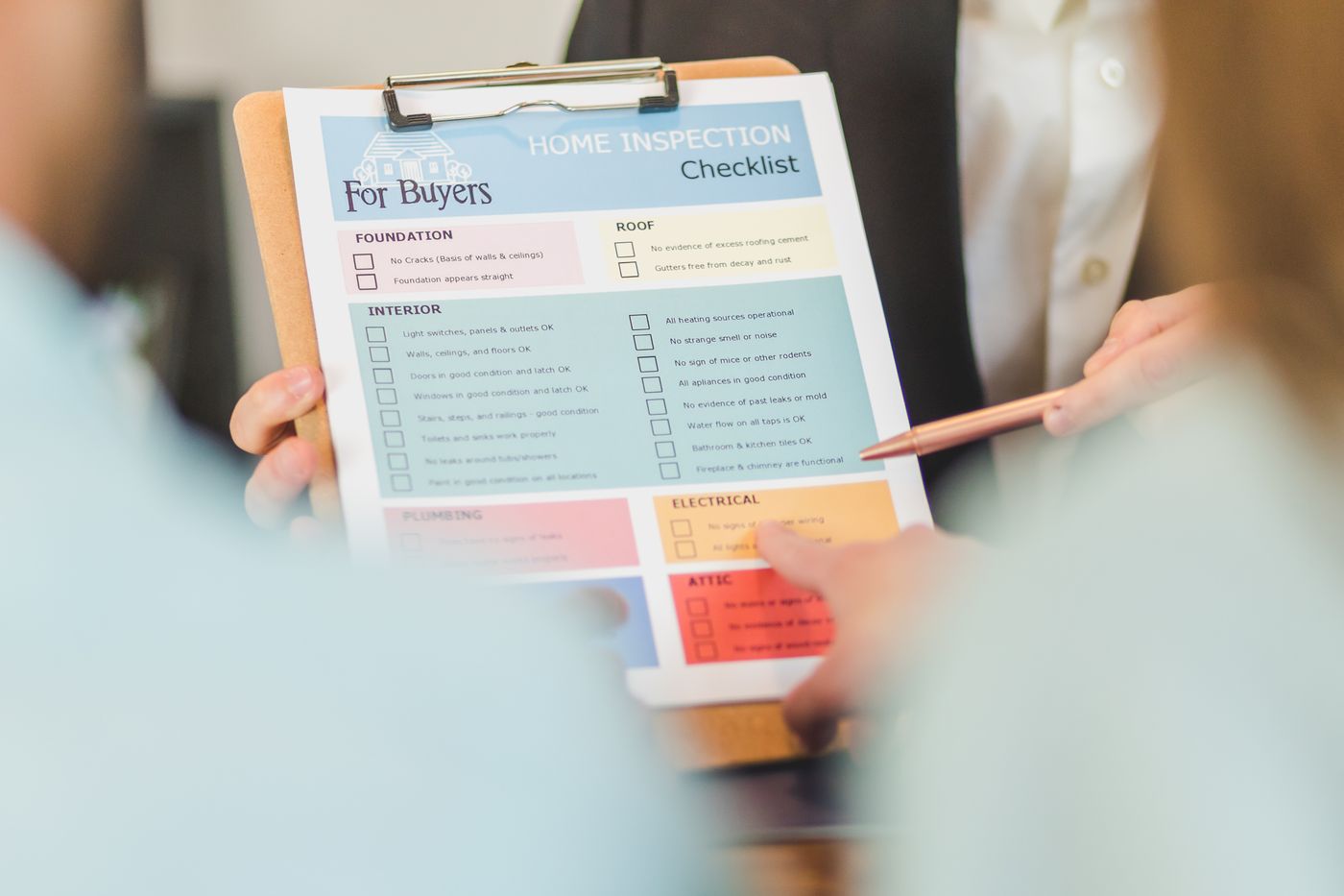A home inspection checklist being reviewed